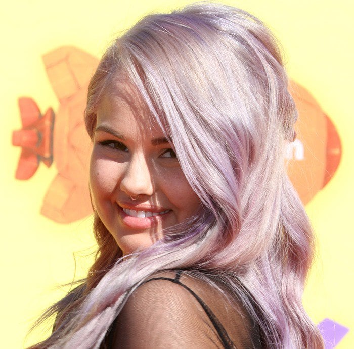 Debby Ryan shows off her lavender hair on the orange carpet of the 2015 Nickelodeon Kids’ Choice Awards