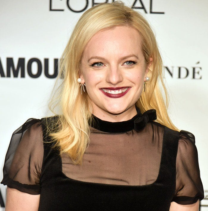 Elisabeth Moss in a black sheer panel mini frock by Jill Stuart
