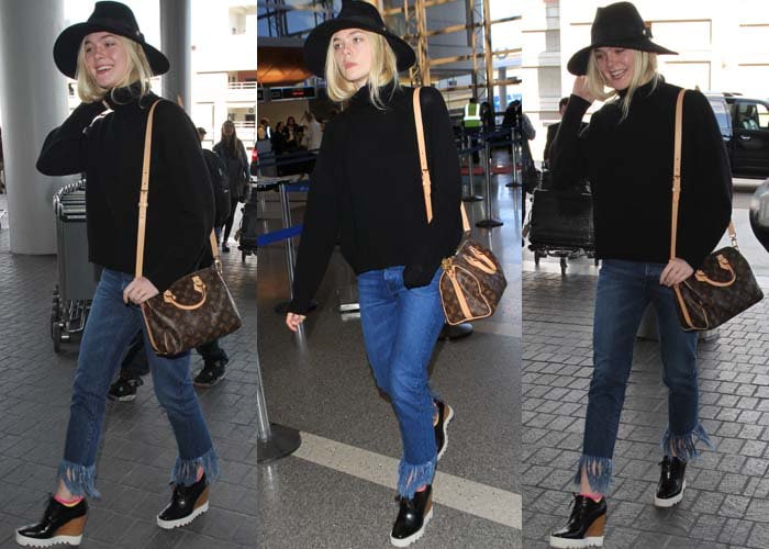 Elle Fanning embraces off-duty eclecticism at LAX, pairing a black sweater and fringed-hem jeans with Stella McCartney platform wedge oxfords for a comfortable yet fashion-forward travel look