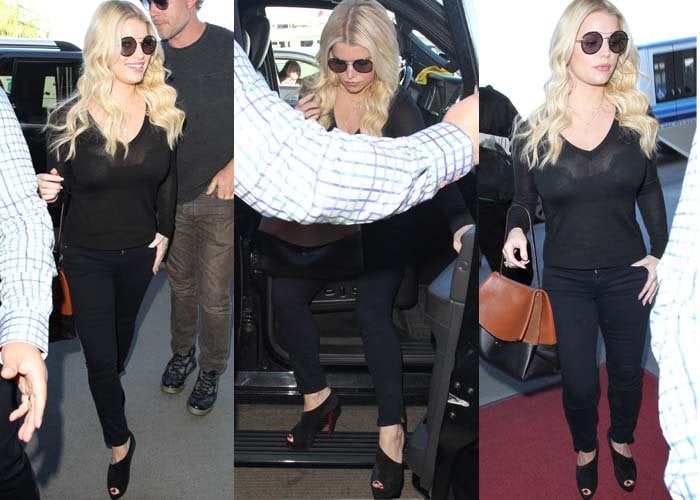Jessica Simpson wears an all-black airport outfit with Christian Louboutin Verita bootie sandals at LAX