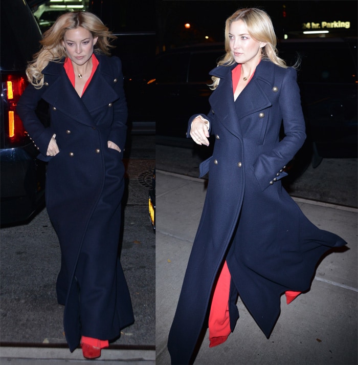 Earlier in the evening, Kate Hudson styled the same navy Chloé maxi coat over a vivid red jumpsuit, letting the dramatic sweep of the outerwear and coordinating red heels create a striking after-dark contrast