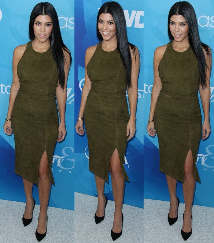Kourtney Kardashian pairs an olive Alice + Olivia suede top and “Tani” pencil skirt with pointed-toe Gianvito Rossi pumps, extending the tonal look from dress to shoes