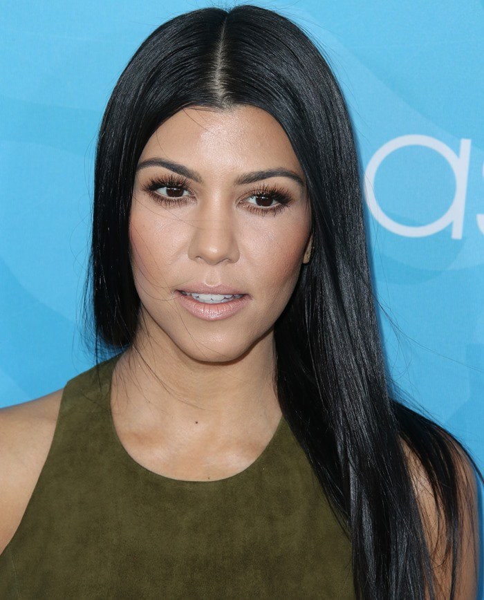 The rich olive suede of Kourtney Kardashian’s Alice + Olivia racerback top brings texture to an otherwise streamlined monochrome look