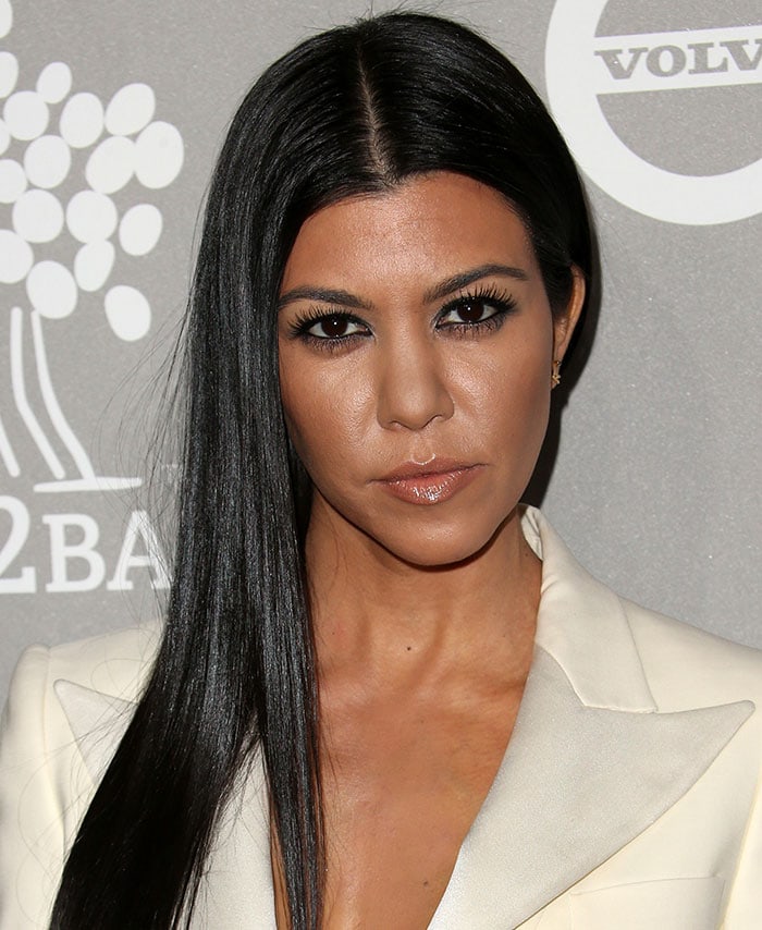 Kourtney Kardashian wears her hair center-parted with nude lip gloss at the 2015 Baby2Baby Gala