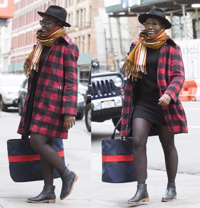 Lupita Nyong’o steps out in chic Parisian-inspired style, pairing Matt Bernson Black Arrow ankle booties with a plaid Woolrich coat, sheer tights, and a mini dress while arriving for the Eclipsed matinee in New York on November 22, 2015