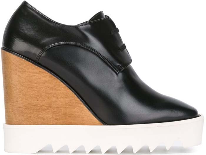 The Stella McCartney faux-leather wedge oxford combines a sleek pointed toe with a dramatic platform sole, blending menswear-inspired styling with modern height