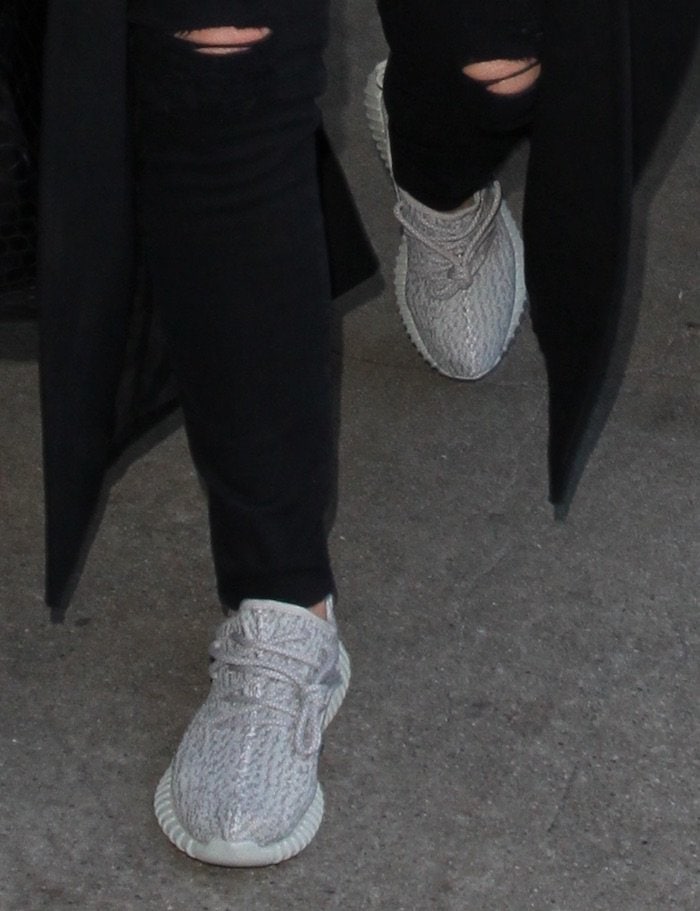 A closer look at Kris Jenner's Adidas Yeezy Boost 350 "Moonrock" sneakers reveals the signature Primeknit construction and monochromatic grey palette that helped define the silhouette's minimalist appeal