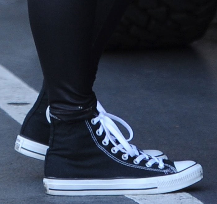 Converse Chuck Taylor All Star high-tops in black canvas with contrast white stitching, rubber toe caps, lace-up fronts, and chunky soles