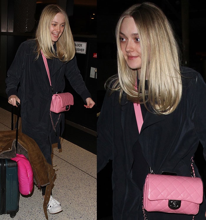 Smiling as she moves through LAX, Dakota pairs her all-black travel uniform with a standout bubble-pink Chanel bag