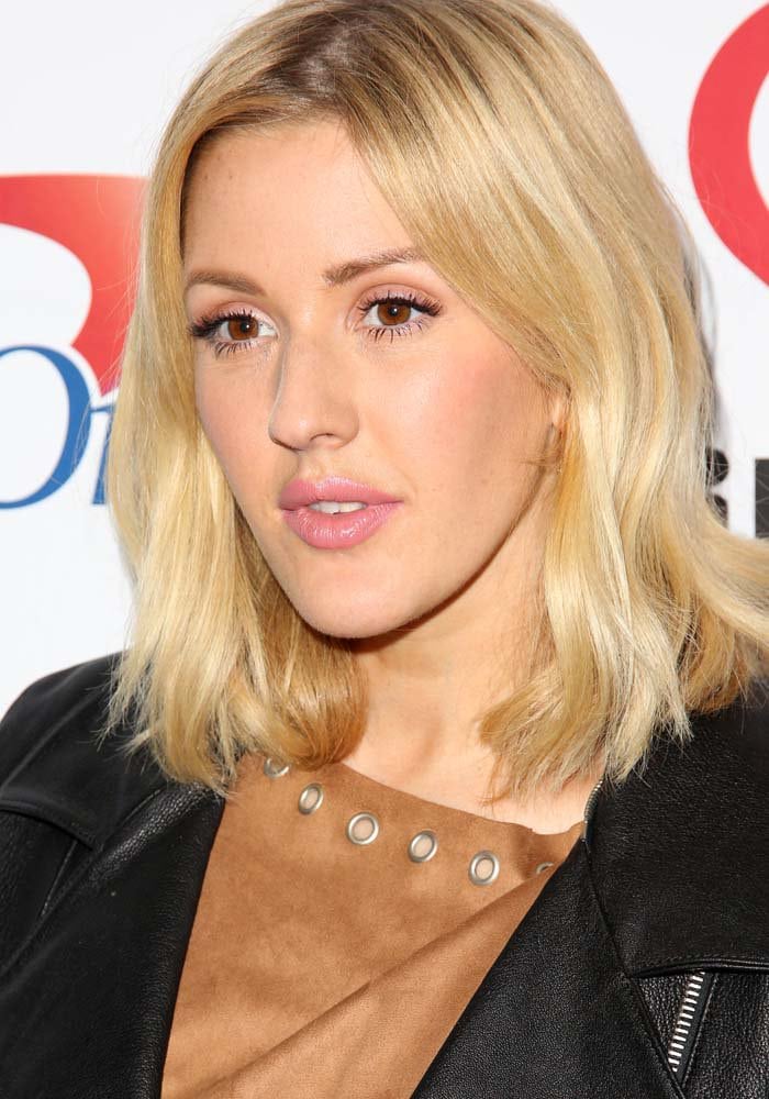 Ellie Goulding, with her blonde hair styled down and soft makeup, at KIIS FM’s Jingle Ball 2015