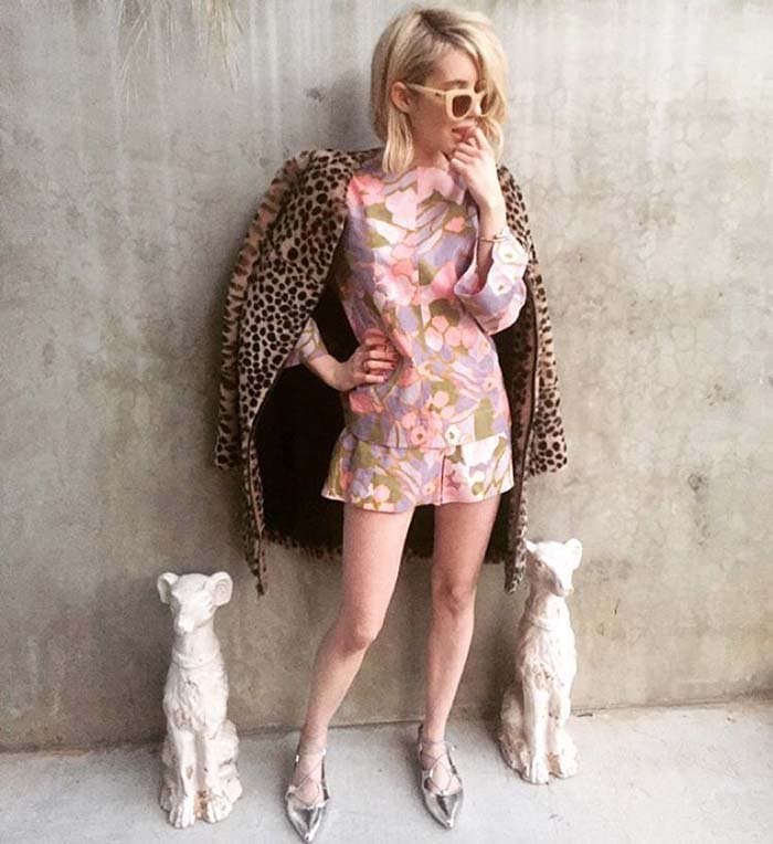 Emma Roberts layers a leopard-print Loeffler Randall shearling coat over a pastel floral Zimmermann set, finishing the playful look with metallic Loeffler Randall "Ambra" flats and Quay sunglasses in an Instagram photo shared on November 20, 2015