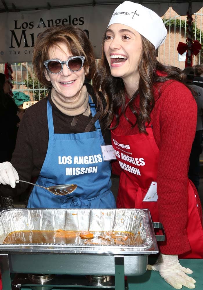 Emmy Rossum shared a candid moment with her mother while serving meals at the Los Angeles Mission, bringing a personal warmth to the Christmas Eve event