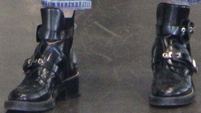 Bella Hadid's feet in stylish double-buckle strap Balenciaga boots during a shopping trip