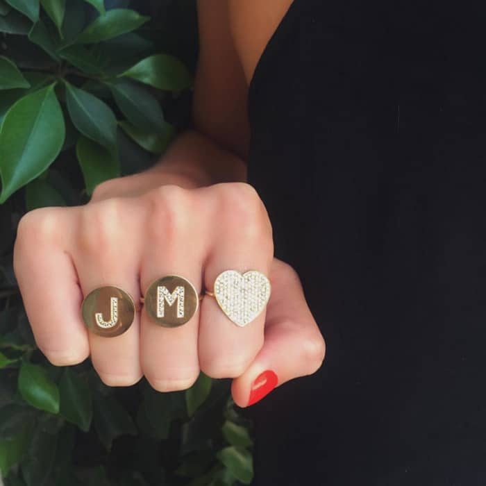 Jennifer Meyer is well-known for diamond-embellished circle letter pendants and rings
