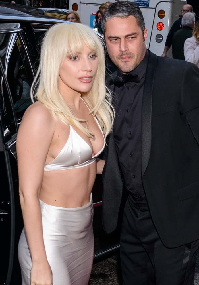 Lady Gaga arrives with then-fiancé Taylor Kinney at the Billboard Women in Music Awards held at Cipriani 42nd Street in New York City on December 11, 2015