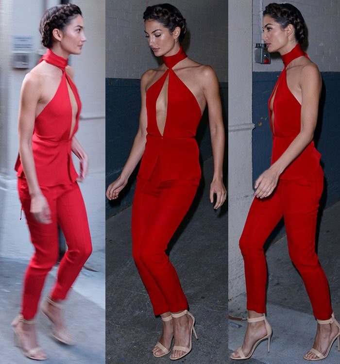 Moving through New York, Aldridge’s tailored red ensemble reveals its sculptural cut from every angle, with minimalist ankle-strap heels keeping the look sleek and uninterrupted