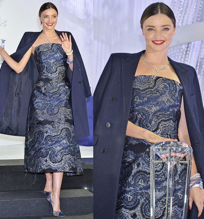 Miranda Kerr paired a strapless Osman dress in swirling navy and silver jacquard with coordinating Jimmy Choo lace pumps and Swarovski jewelry