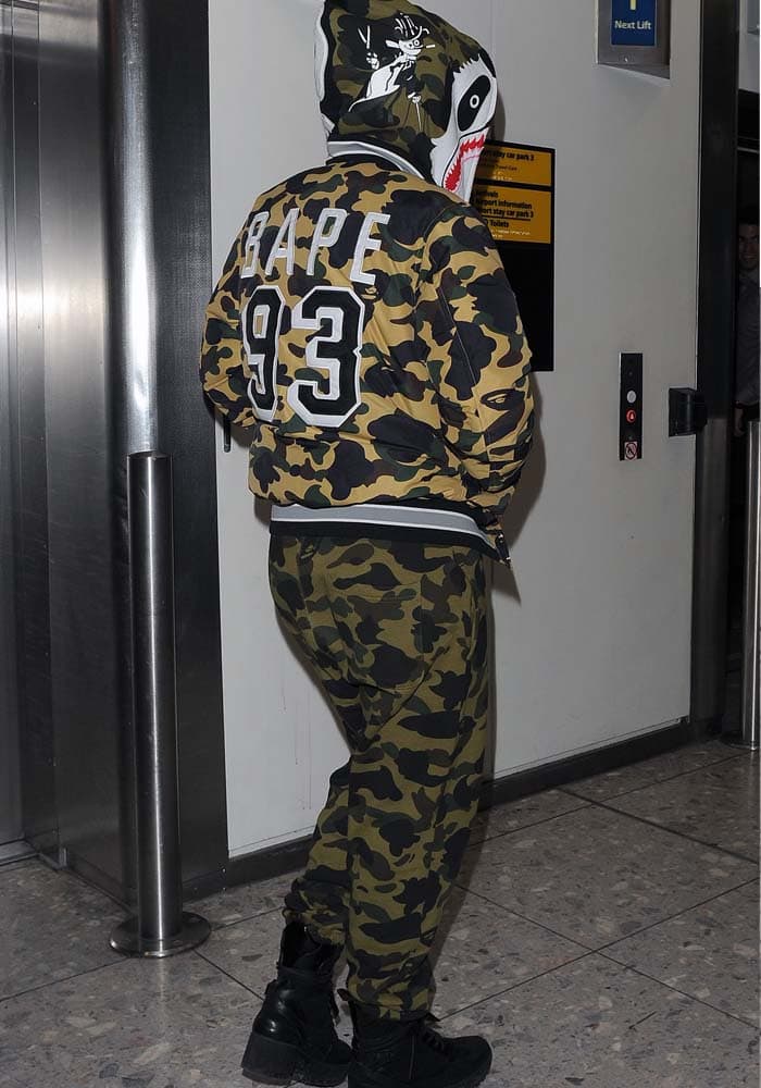 Rita Ora wears an all-camouflage outfit with a pair of "Palm Canyon Desert" boots at London's Heathrow Airport