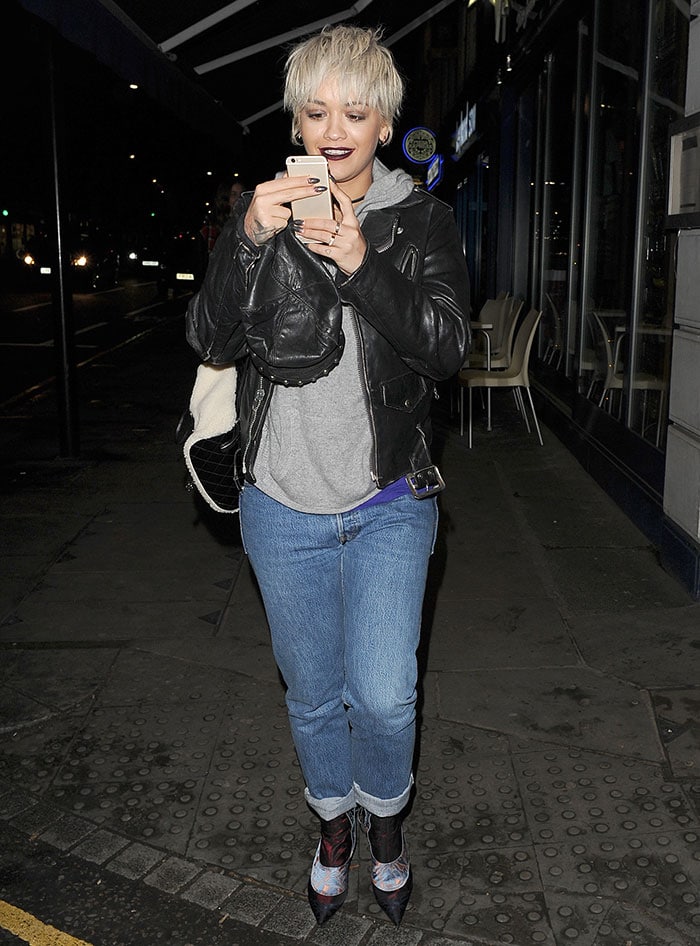 Rita Ora sports her fresh pixie hairstyle and layered off-duty ensemble while out for a late-night meal at Pizza Express in London