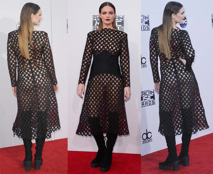 Tove Lo wears a sheer black mesh midi dress, anchoring the daring silhouette with chunky black platform ankle boots on the red carpet
