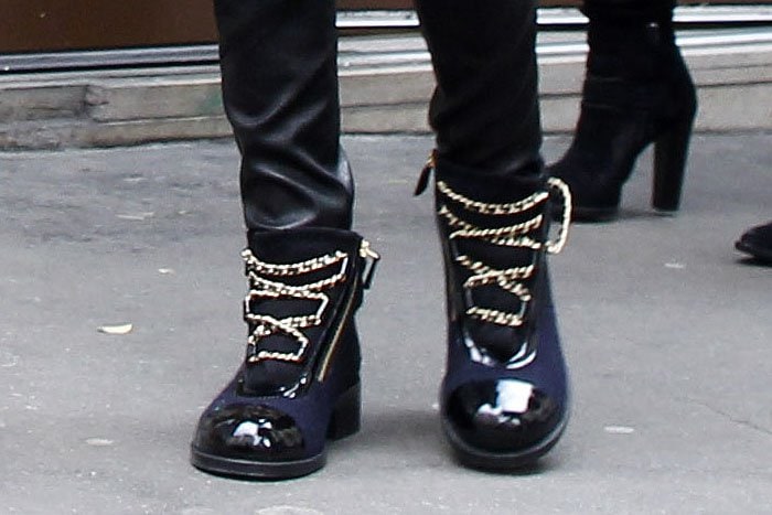 Cara Delevingne wears a pair of blue-and-black Chanel boots in Paris