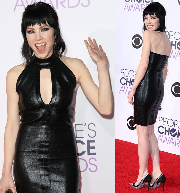 Jepsen shows off the edgy keyhole neckline and sleek backless silhouette of her leather dress while posing playfully on the red carpet