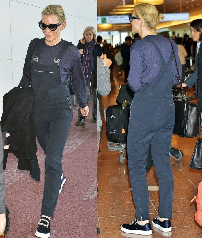 Cate Blanchett balances utility and luxury in slim-cut overalls and Roger Vivier’s crystal-buckle Sneaky Viv sneakers while navigating Narita Airport with a black cardigan in hand