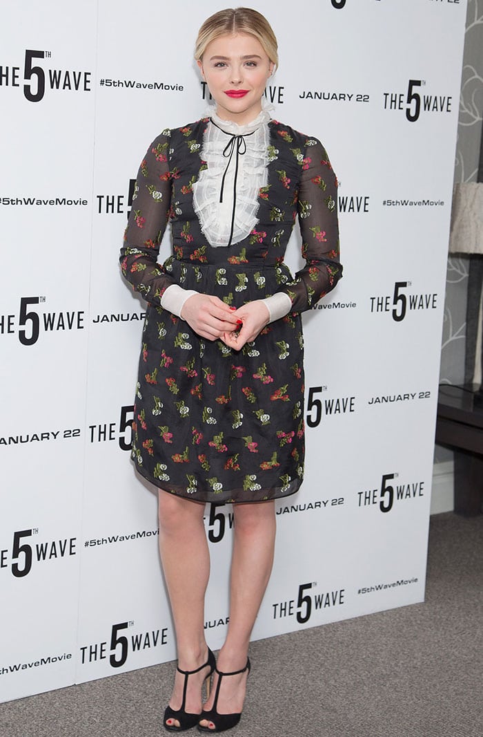 Chloë Grace Moretz exudes vintage charm in a floral Erdem dress with a ruffled lace collar and sheer sleeves
