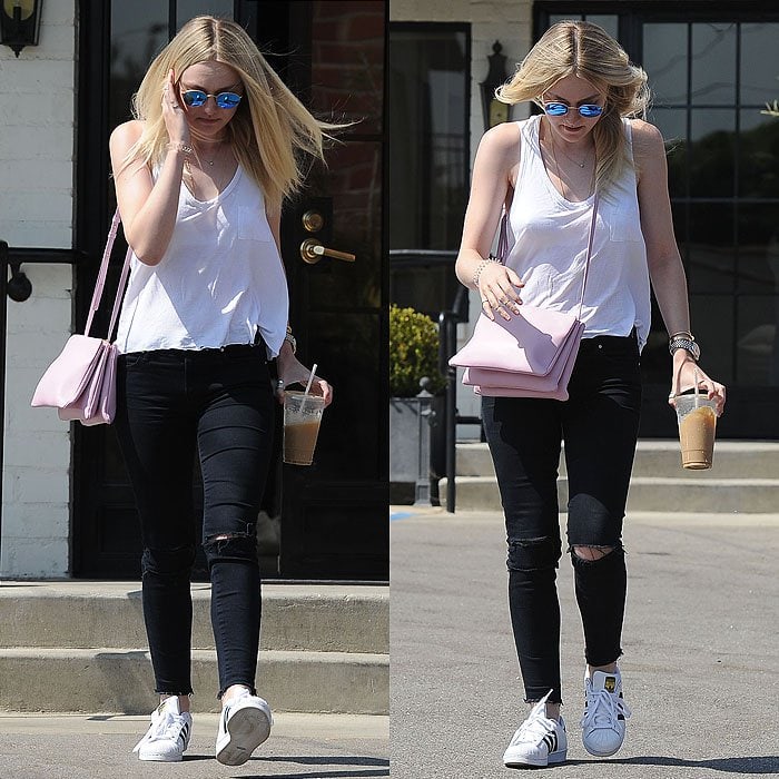 Dakota Fanning gives her classic tank-top-and-jeans uniform a fresh update with clean white sneakers while leaving Ramirez Tran hair salon in Los Angeles on August 20, 2015