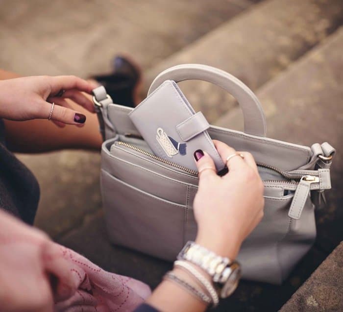 Elena shows off the handbag that helps her stay organized