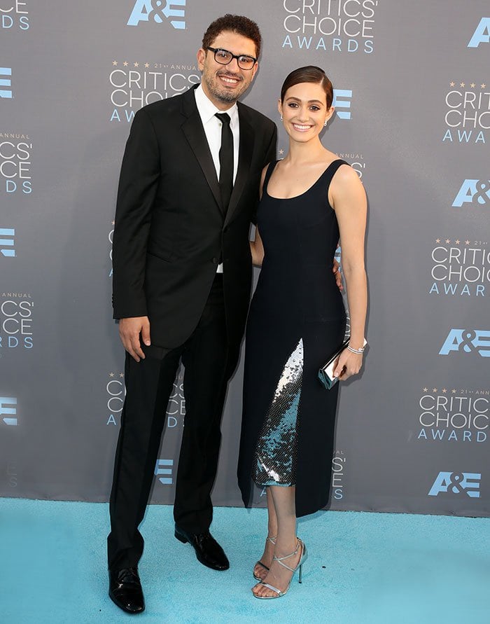 Emmy Rossum and Sam Esmail coordinated classic black eveningwear at the Critics’ Choice Awards, with Rossum’s metallic Jimmy Choo sandals adding a lighter, reflective contrast to the monochrome palette