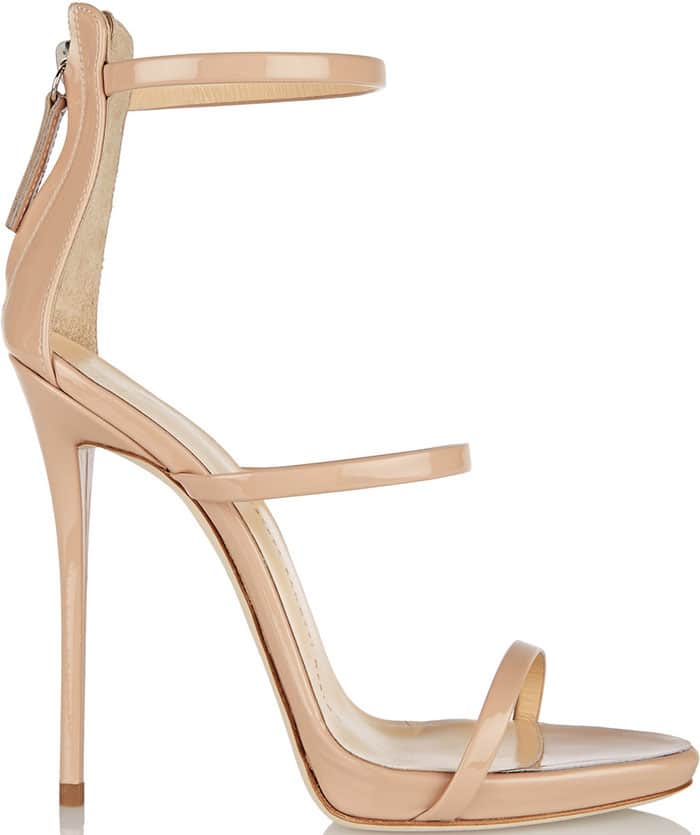 This nude Giuseppe Zanotti stiletto sandal features a sleek triple-strap design, a slim ankle cuff, and a high-gloss finish that embodies the brand’s signature minimalist glamour