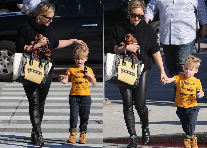 Hilary Duff balanced edgy and practical style in studded Marc by Marc Jacobs “Carroll” boots, leather pants, and a Céline tote while guiding son Luca through a Beverly Hills crosswalk