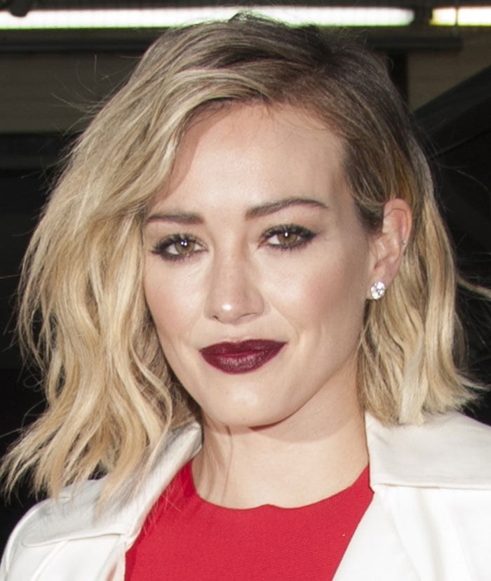 Hilary Duff wears her blonde hair down as she arrives at AOL Build in New York City