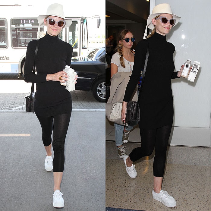Jaime King elevates her airport athleisure with crisp white sneakers, letting them anchor a sleek black travel look finished with a fedora and retro cat-eye sunglasses