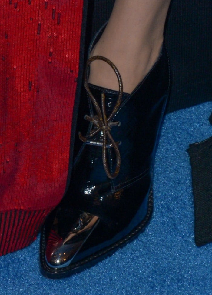 Jennifer Connelly pairs her sequined Louis Vuitton gown with sleek black lace-up Louis Vuitton booties featuring a metallic cap toe