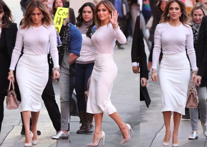 Jennifer Lopez pairs a white long-sleeved top with a pale pink Roland Mouret Arreton pencil skirt