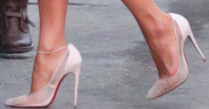 Jennifer Lopez wears white lace Christian Louboutin Pigalace pumps with red soles