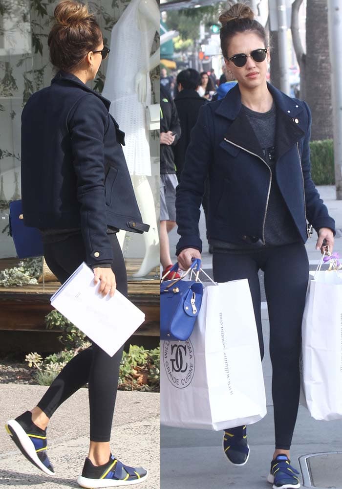 Jessica Alba runs errands in West Hollywood on January 17, 2016, wearing Beyond Yoga Essential Long Leggings with a navy moto jacket, accessorized with Ray-Ban Clubmaster sunglasses, a Viktor Rolf Bombette bag, and an Anita Ko ear cuff, while Adidas x Stella McCartney sneakers add a sleek, sporty finish to her off-duty look
