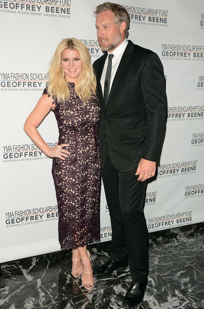 Jessica Simpson poses with her husband Eric Johnson on the gala carpet in a plum lace Monique Lhuillier dress and nude Giuseppe Zanotti heels