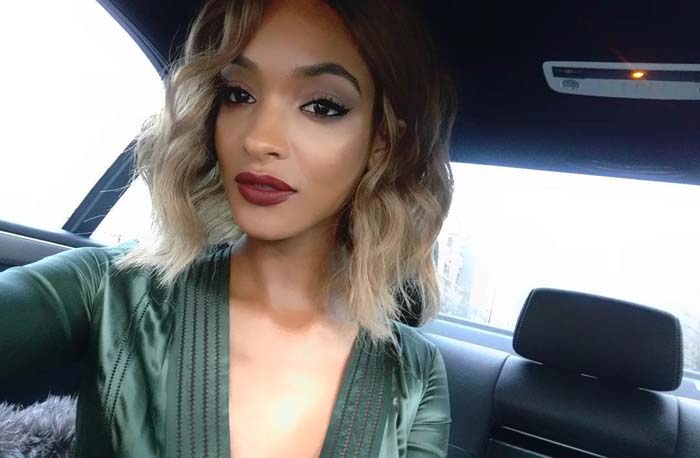 Jourdan Dunn wears a green Burberry dress in a car