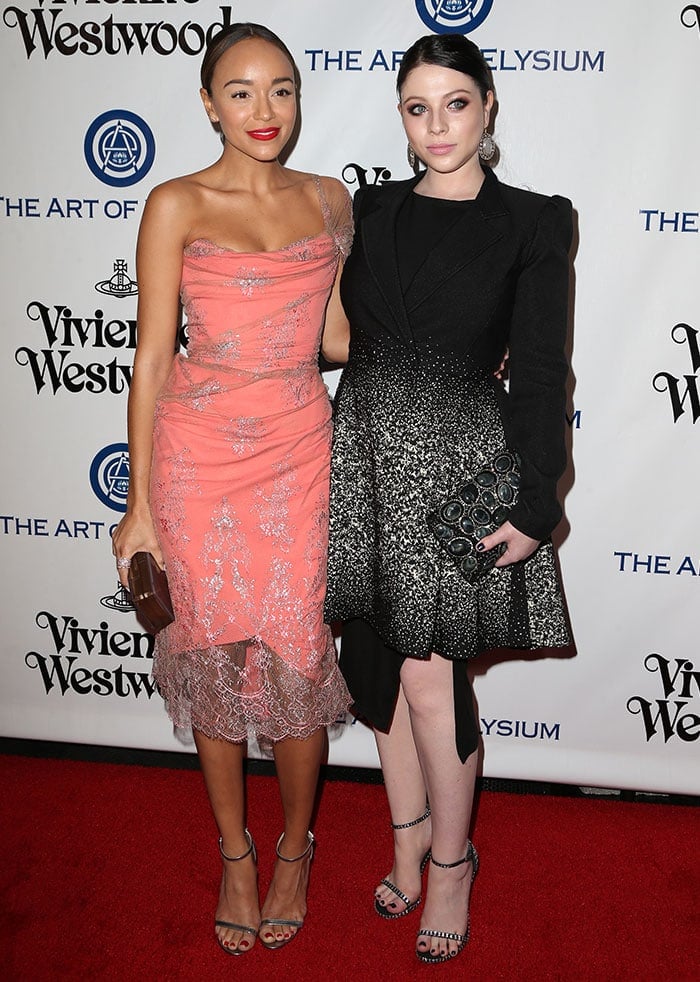 Ashley Madekwe stuns in a coral lace dress with silver sandals, while Michelle Trachtenberg channels gothic glamour in a black ombré coat dress paired with crystal-embellished Stuart Weitzman heels