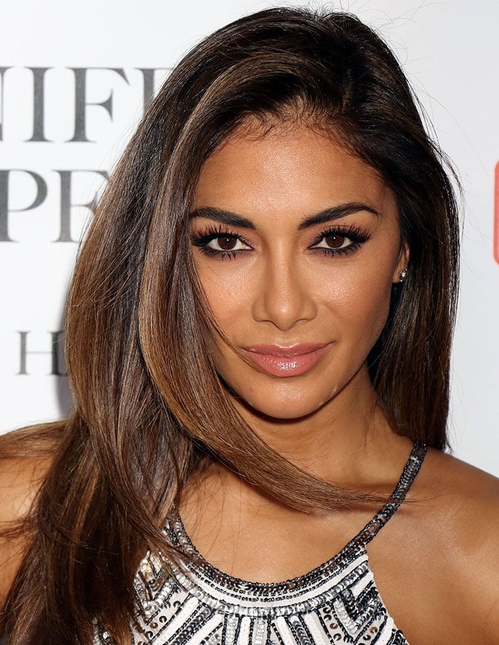 Nicole Scherzinger's brunette hair was worn loose and parted to the side