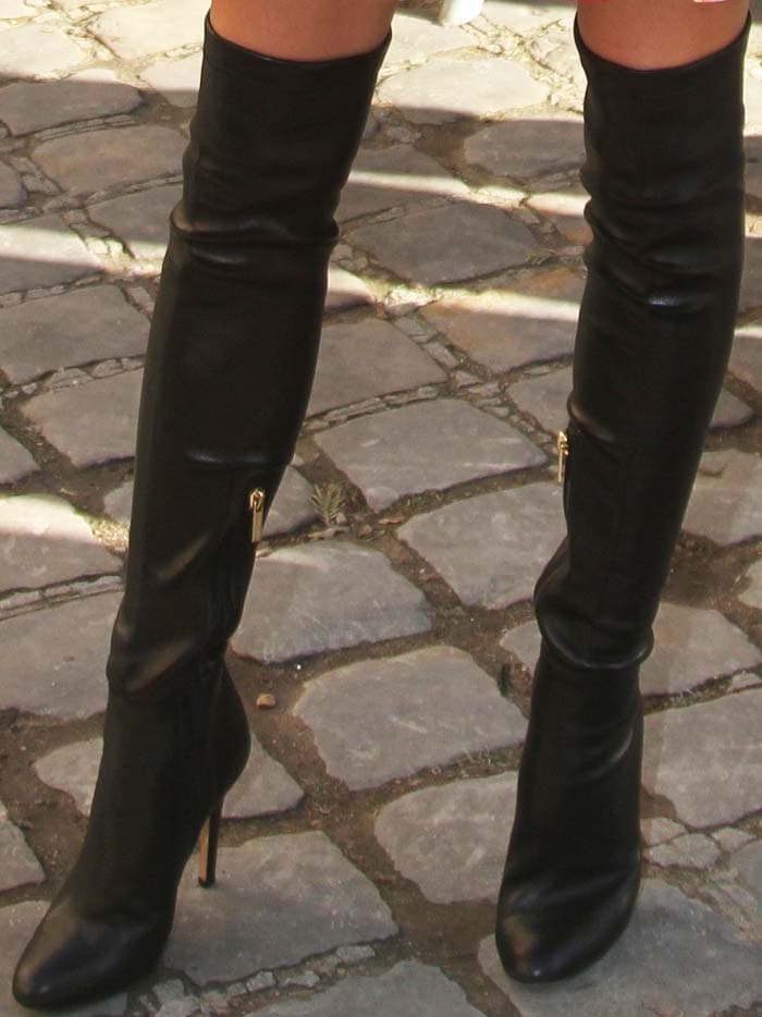 Olivia Palermo’s Jimmy Choo “Toni” over-the-knee boots, featuring a pointed toe and stiletto heel