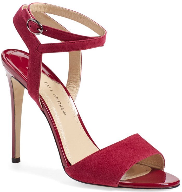 Paul Andrew “Laura” Ankle-Strap Sandal — A sultry take on the minimalist two-strap silhouette, crafted in rich wine-red suede with a slender ankle buckle and sky-high stiletto heel for leg-lengthening elegance