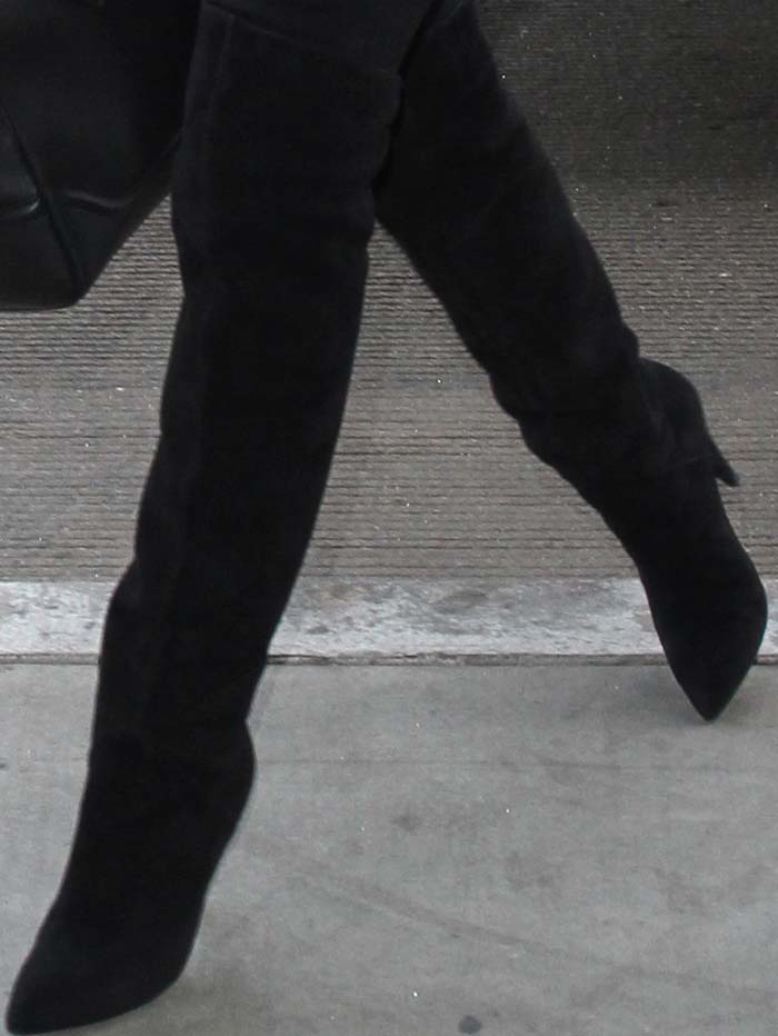 Rosie Huntington-Whiteley wears a pair of Saint Laurent over-the-knee boots