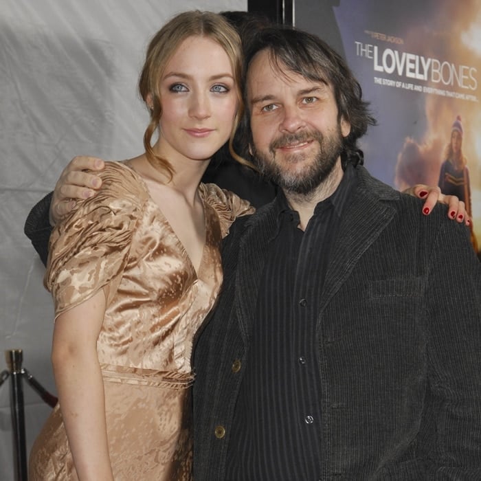 Saoirse Ronan exudes vintage elegance in a champagne-hued puff-sleeve dress as she poses with director Peter Jackson at The Lovely Bones premiere at Grauman's Chinese Theatre in Hollywood on December 7, 2009