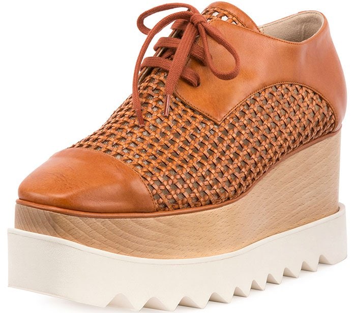 The woven leather Stella McCartney Elyse platform oxfords combine handcrafted texture with the designer's instantly recognizable wooden wedge and chunky serrated sole