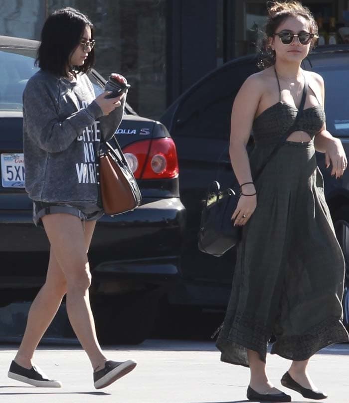 Vanessa Hudgens and her sister Stella Hudgens step out in contrasting casual looks—Vanessa in a laid-back sweater and shorts combo, while Stella opts for a breezy halter dress