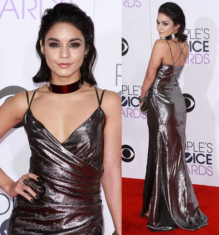 The reflective fabric caught the light from every angle, emphasizing the gown's body-skimming silhouette and high slit.